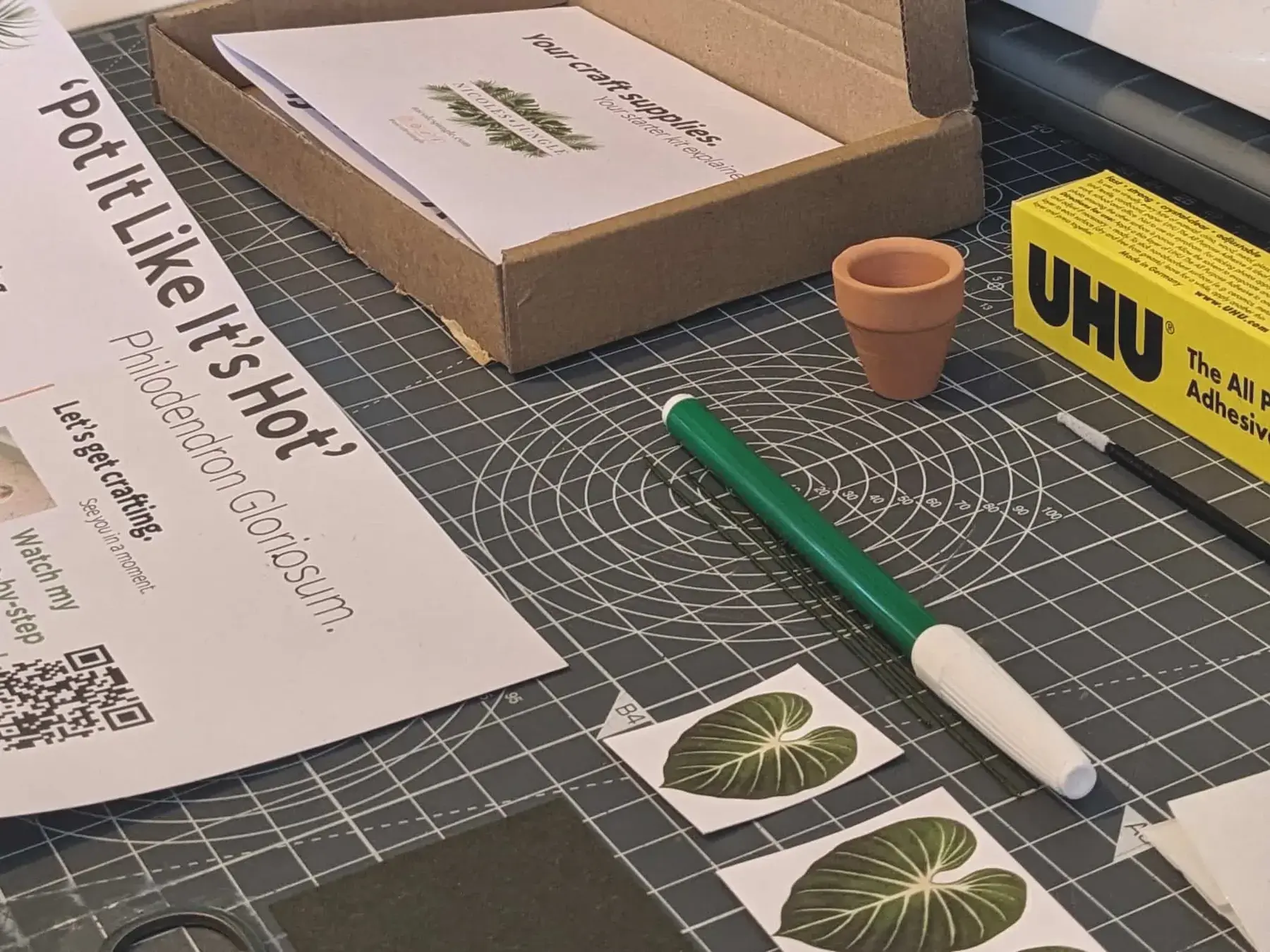 Philodendron gloriosum paper plant kit laid out on a cutting mat